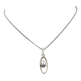 Stylish long oval pendant with a similarly oval shaped gemstone