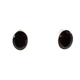 Sundari sterling silver stud earrings with a faceted oval shape gemstone
