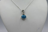 Oval Shaped simple but elegant pendant with a cabochon stone