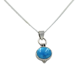 Oval Shaped simple but elegant pendant with a cabochon stone